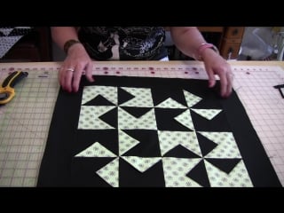 A two hour quick and easy dimensional pinwheel table top quilt