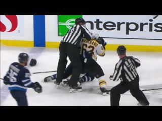 Gotta see it brad marchand and nikolaj ehlers drop the gloves after big hit