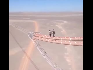 Inspecting high voltage transmission lines thank god they are wearing their hard hats, safety first!