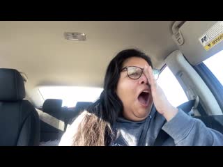 Goddess tara exhausted yawning in the car