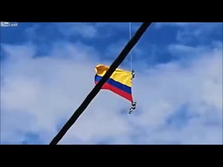 Colombia airmen plunge to porn wrapped in flag during stunt
