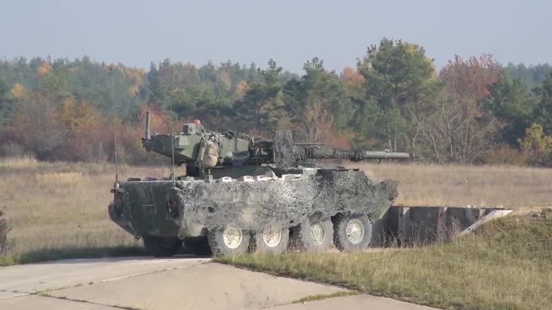 Stryker family in action m1128 mobile gun, m1126 icv 30mm dragoon engage simulated targets