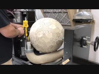 Guy makes a big ball out of plywood