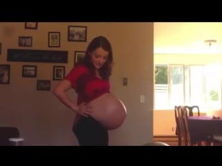 Beautiful young woman pregnant belly oval belly pregnant with big twins new