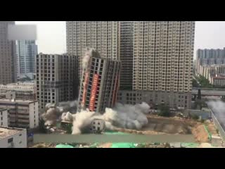 Boom! tons of explosive was used to blast 2 unfinished buildings in zhengzhou, c chinas henan