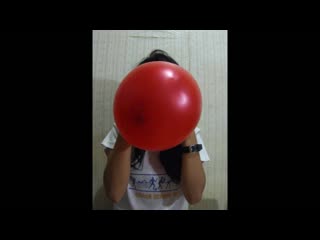 Blowing up a deformed red balloon until it pops