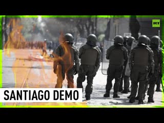 Chilean protesters doused with water cannons at young combatant's day celebration