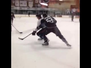 Shea theodore and nick ritchie battle for the puck