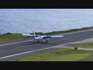 Twin otter landing at saba