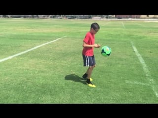 11 year old solves a rubiks cube while juggling a soccer ball