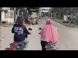 Idiots on scooter meanwhile, in indonesia