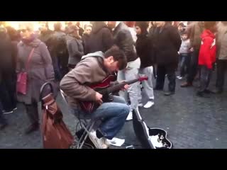 Street guitarist (marcello calabrese) plays stairway to heaven