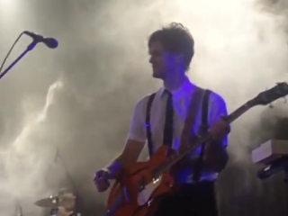 Brendon urie slapping dallon weekes on the ass and kissing him after