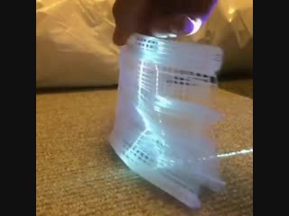 This light projection on paper cutout art making animated figure
