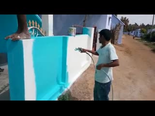 Spray painting a house in tamilnadu, india