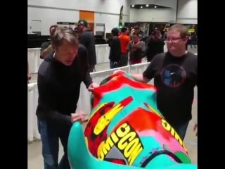 Mads doing some signing of a cow for charity! src