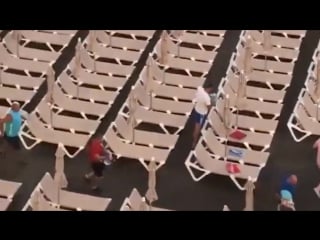 Dozens of britons race to get their towels down as soon as the pool opens at 8am