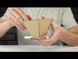 Diy puppy dog food dispenser from cardboard at home