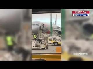 Man charged for assaulting staff while trying to open plane door