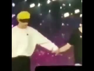 Jungkook placing his mic on his other hand so he can fully hold taehyung’s hand, this is t