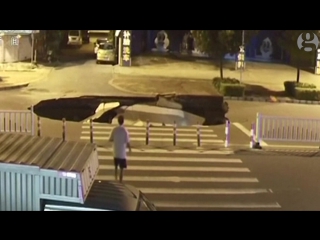 Man on a scooter plunges into sinkhole