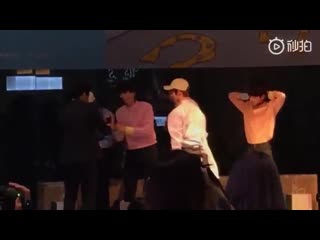 The members throwing hearts before exiting the fanmeeting, soobin taking off his white robe and taehyun having a hard time on ta