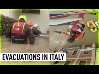 Italian rescue teams evacuate residents from flooded homes