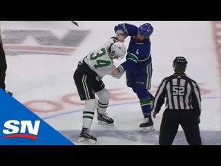 Jordie benn fights denis gurianov after big hit on nicholas caamano