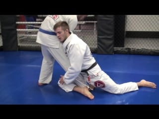 Wolverine arm drag to ko uchi gari (a leg trip)