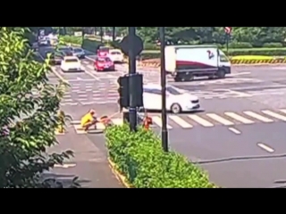 Woman falls into manhole after being hit by car amazing clip