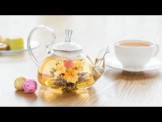 Tea ball marigold, blooming tea in hot water,