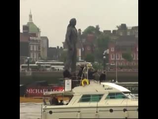 June 15th, 1995, a larger than life michael jackson statue was floated on a barge through london, england down the thames river