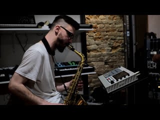 Dmibeats at studio with akai mpc live ii and saxophone