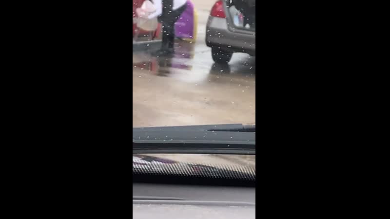 Woman tries to carry gas in plastic bag to her car's trunk
