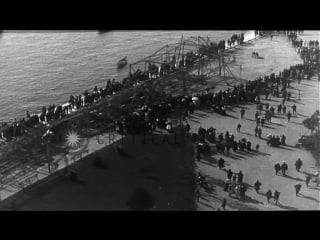 Wreckage of german zeppelin is displayed on dock near the white tower in stock footage