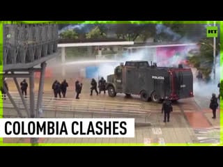 Stones, tear gas and water cannons protesters clash with cops in bogota