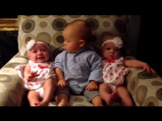 Adorably confused baby meets twins
