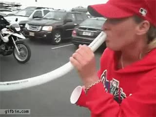 Phillies fan drinking from bong gets a high five from cop