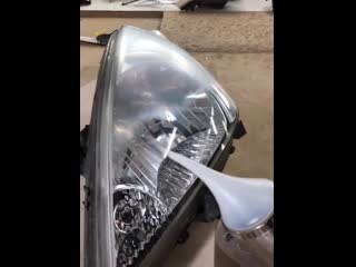 Using acetone vapor to clear a headlight