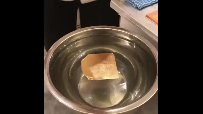 @ dipping the chestnut truffle into edible gold leaf