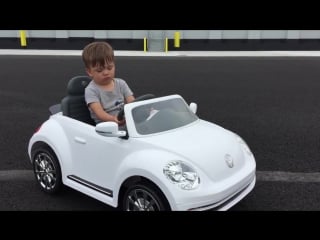 Sleepy toddler drives toy car hot wheels, sleepin away