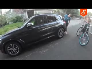 Biker distracts lady on a bike