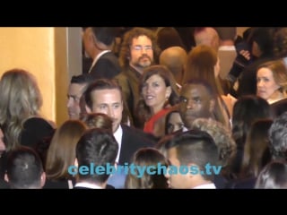 Actor ryan gosling and emma stone mingle with the crowd outside la la land