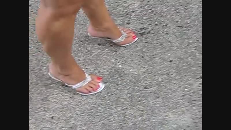 Mature feet in high heeled thong mules