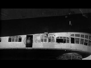 Lz 127 graf zeppelin airship in flight and being maneuvered on ground, at lakehur hd stock footage