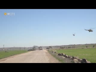 Russian military police conducting a joint russian turkish patrol in kobani countryside