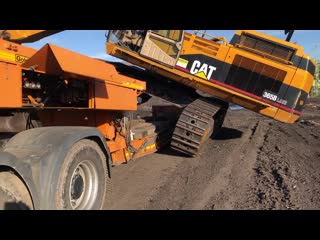 Loading and transporting the cat 365b fasoulas heavy transports