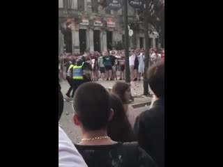 Kicking off in porto after england fans throw bottles at police who respond by charging at them
