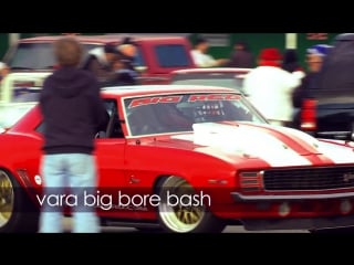 Big red camaro driving fast taking chances