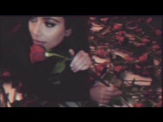Kim kardashian flashes her bum as she rolls around in a bed of roses on valentines day